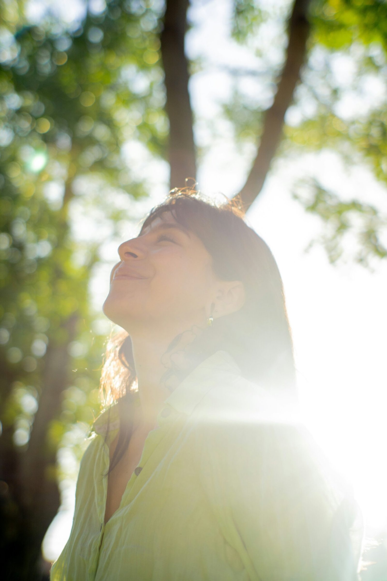 How to Naturally Boost Serotonin and Endorphins to Improve Your Daily Well-Being 1 a woman smiling with trees in the background